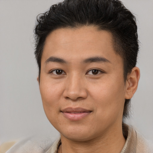 Joyful asian young-adult female with short  brown hair and brown eyes