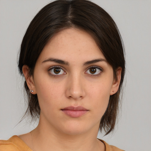 Neutral white young-adult female with medium  brown hair and brown eyes