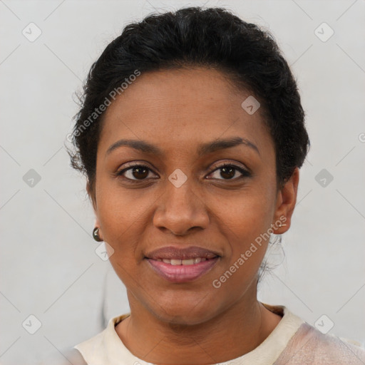 Joyful black adult female with short  brown hair and brown eyes