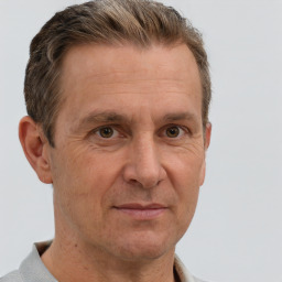 Neutral white middle-aged male with short  brown hair and grey eyes