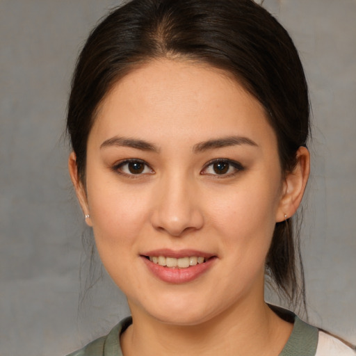 Joyful white young-adult female with medium  brown hair and brown eyes