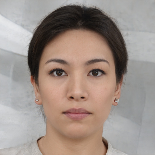 Neutral asian young-adult female with medium  brown hair and brown eyes