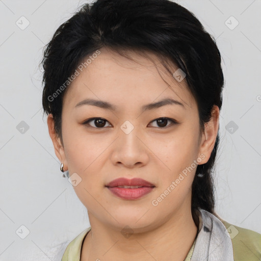 Joyful asian young-adult female with medium  black hair and brown eyes
