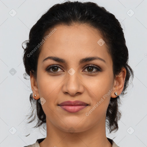 Joyful latino young-adult female with medium  brown hair and brown eyes