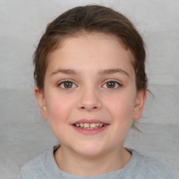 Joyful white child female with short  brown hair and brown eyes