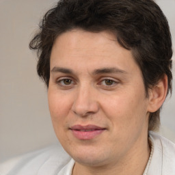 Joyful white adult female with medium  brown hair and brown eyes