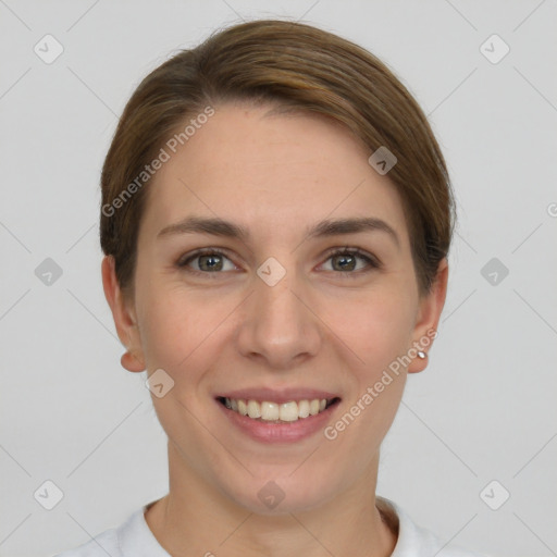 Joyful white young-adult female with short  brown hair and grey eyes