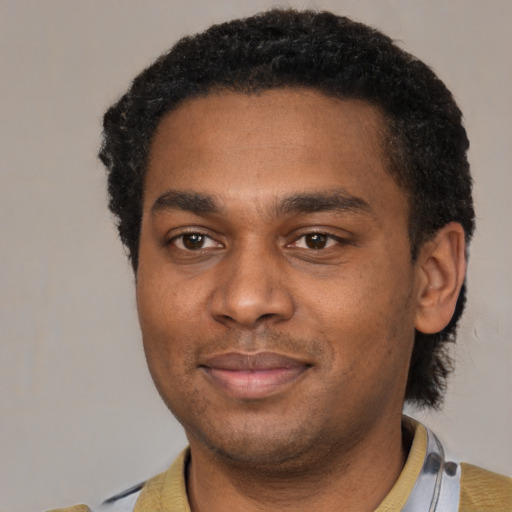 Neutral black young-adult male with short  black hair and brown eyes