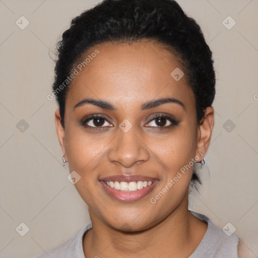 Joyful black young-adult female with short  black hair and brown eyes