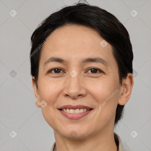 Joyful white adult female with short  brown hair and brown eyes