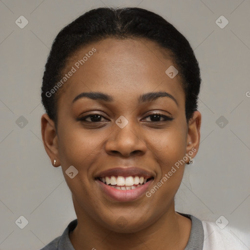 Joyful black young-adult female with short  black hair and brown eyes