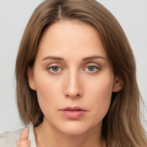 Neutral white young-adult female with medium  brown hair and brown eyes