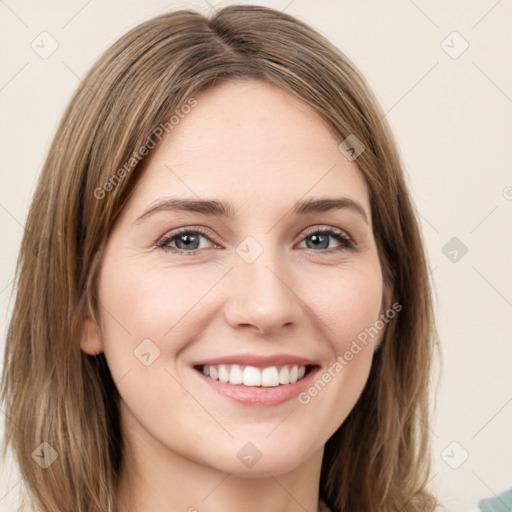 Joyful white young-adult female with medium  brown hair and green eyes