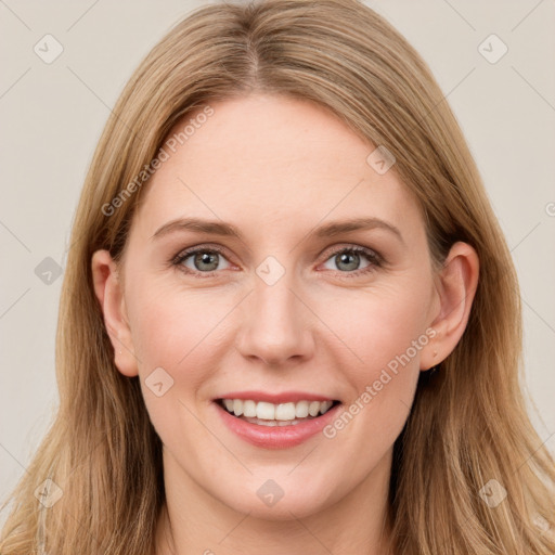 Joyful white young-adult female with long  brown hair and grey eyes