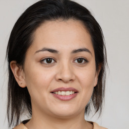 Joyful white young-adult female with medium  brown hair and brown eyes