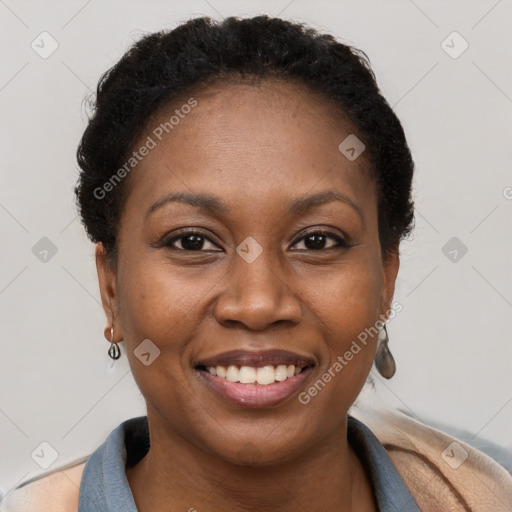 Joyful black young-adult female with short  brown hair and brown eyes