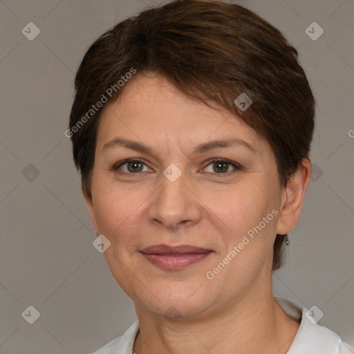 Joyful white adult female with short  brown hair and brown eyes