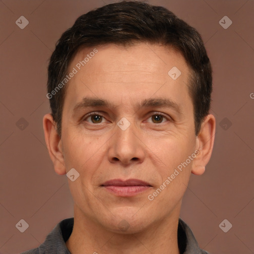 Joyful white adult male with short  brown hair and brown eyes