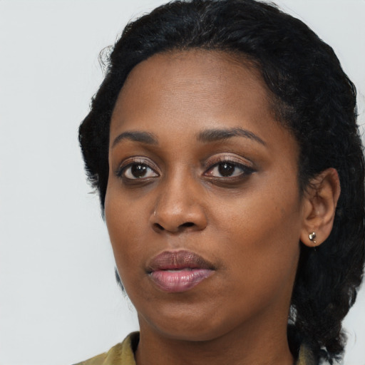 Neutral black young-adult female with medium  black hair and brown eyes