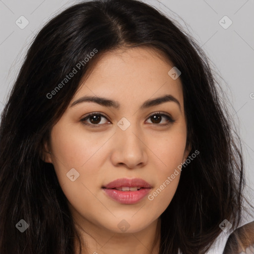 Joyful latino young-adult female with long  brown hair and brown eyes