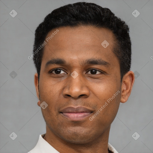 Joyful latino young-adult male with short  black hair and brown eyes