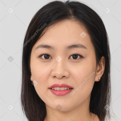 Joyful asian young-adult female with long  brown hair and brown eyes