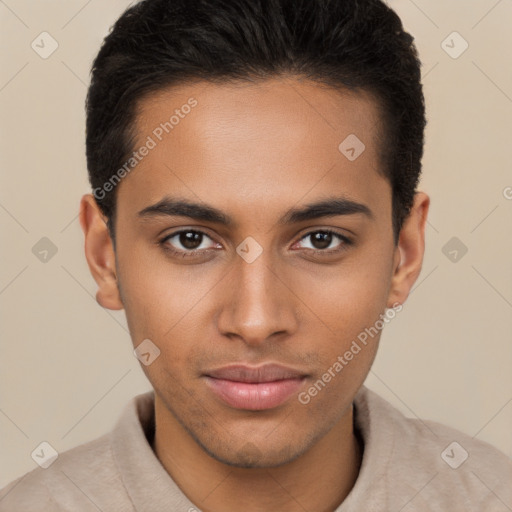 Joyful black young-adult male with short  brown hair and brown eyes