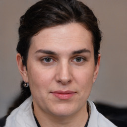 Joyful white young-adult female with medium  brown hair and brown eyes