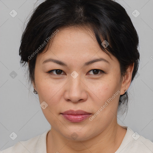 Joyful white adult female with medium  brown hair and brown eyes