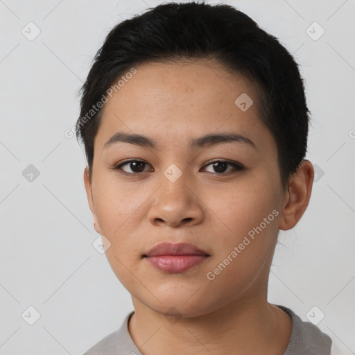 Joyful asian young-adult female with short  black hair and brown eyes