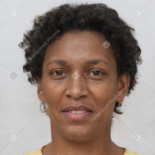 Joyful latino adult female with short  brown hair and brown eyes