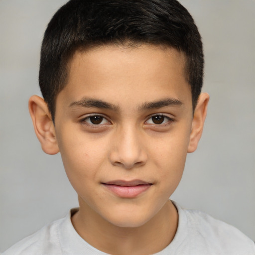 Joyful white child male with short  brown hair and brown eyes