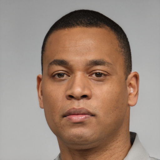 Neutral black young-adult male with short  black hair and brown eyes