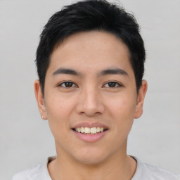 Joyful asian young-adult male with short  black hair and brown eyes