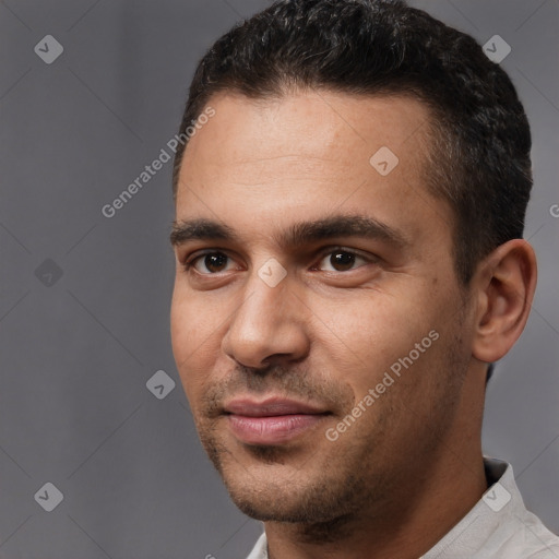 Joyful white young-adult male with short  black hair and brown eyes