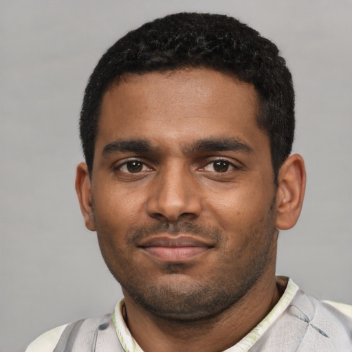 Neutral black young-adult male with short  black hair and brown eyes