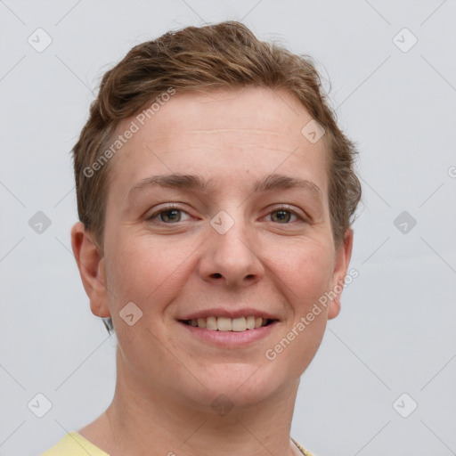 Joyful white young-adult female with short  brown hair and grey eyes