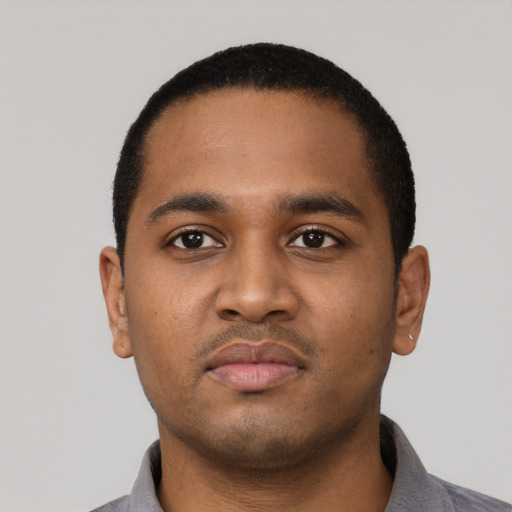 Neutral black young-adult male with short  black hair and brown eyes