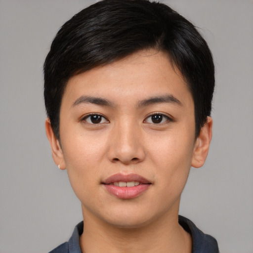 Joyful asian young-adult female with short  black hair and brown eyes