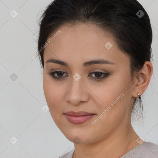 Joyful latino young-adult female with medium  brown hair and brown eyes