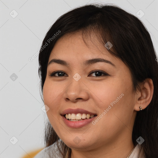 Joyful white young-adult female with long  brown hair and brown eyes