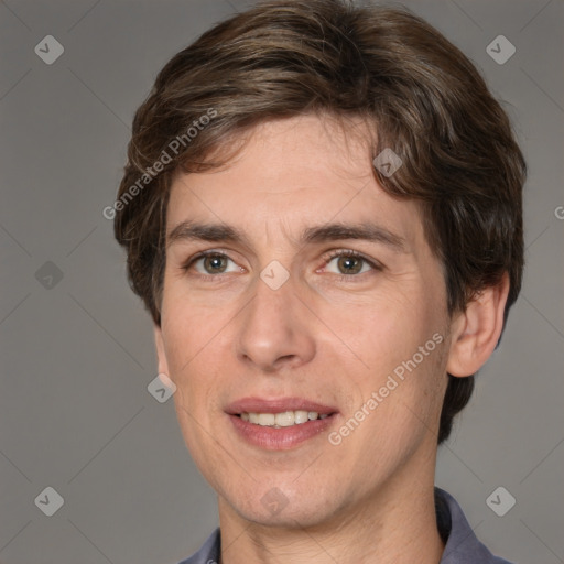 Joyful white adult male with short  brown hair and grey eyes