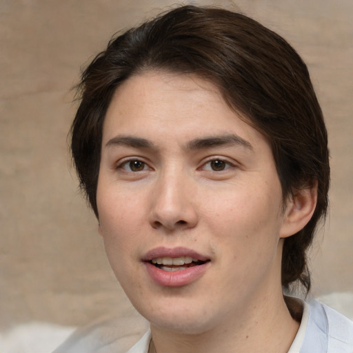 Joyful white young-adult male with medium  brown hair and brown eyes