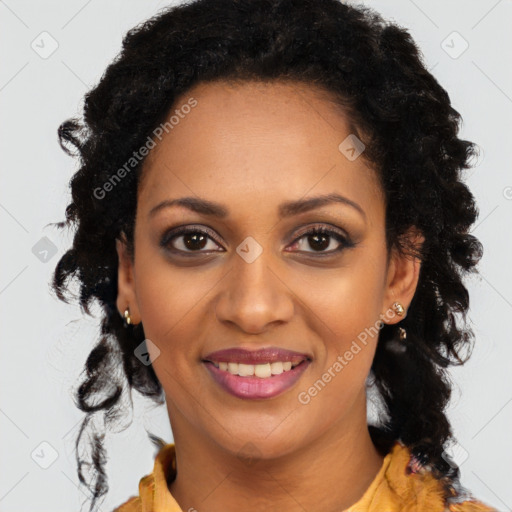 Joyful black young-adult female with long  black hair and brown eyes
