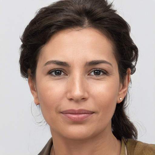 Joyful white young-adult female with medium  brown hair and brown eyes