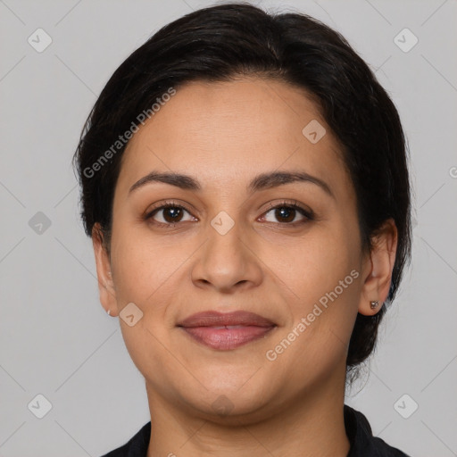 Joyful latino young-adult female with medium  brown hair and brown eyes