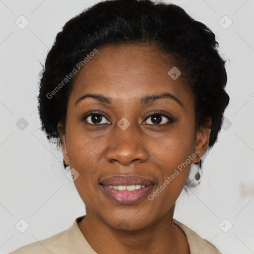 Joyful black adult female with short  black hair and brown eyes