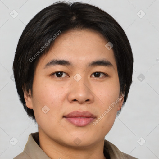 Joyful asian young-adult male with short  brown hair and brown eyes