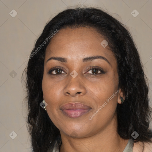Joyful black adult female with long  black hair and brown eyes