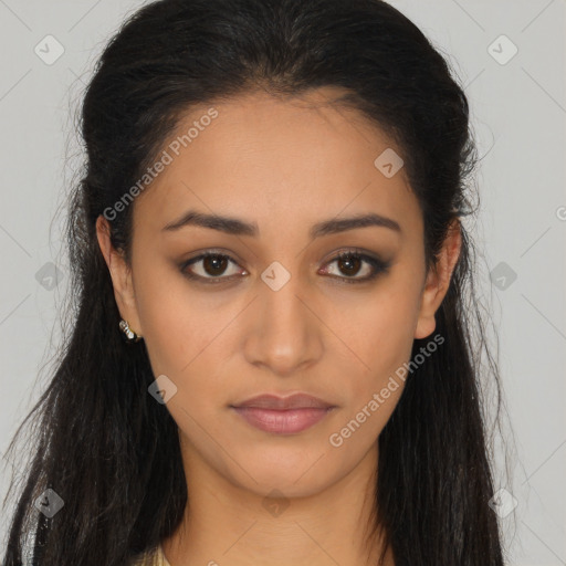 Joyful latino young-adult female with long  brown hair and brown eyes